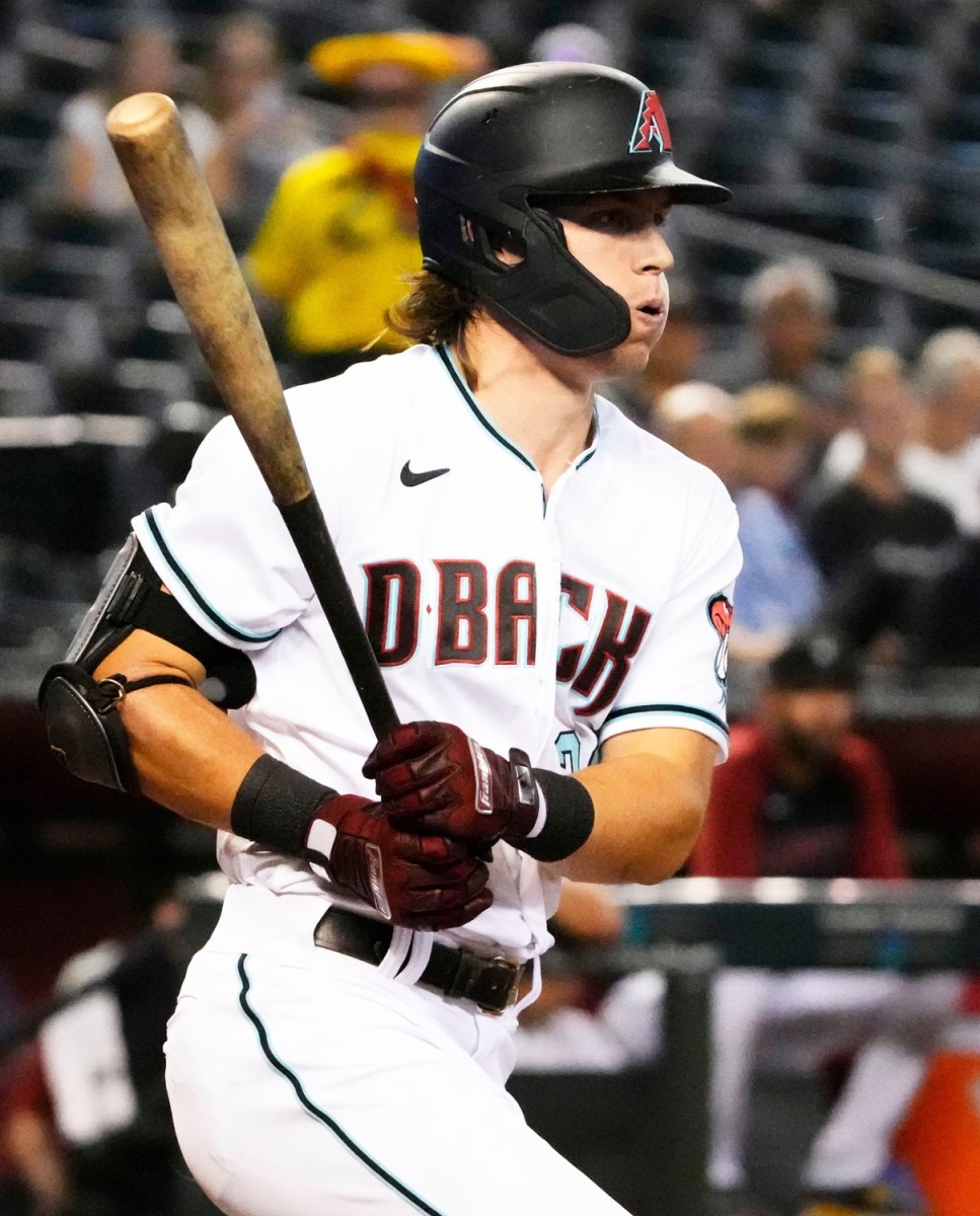 Jake McCarthy swings the bat against the Milwaukee Brewers.